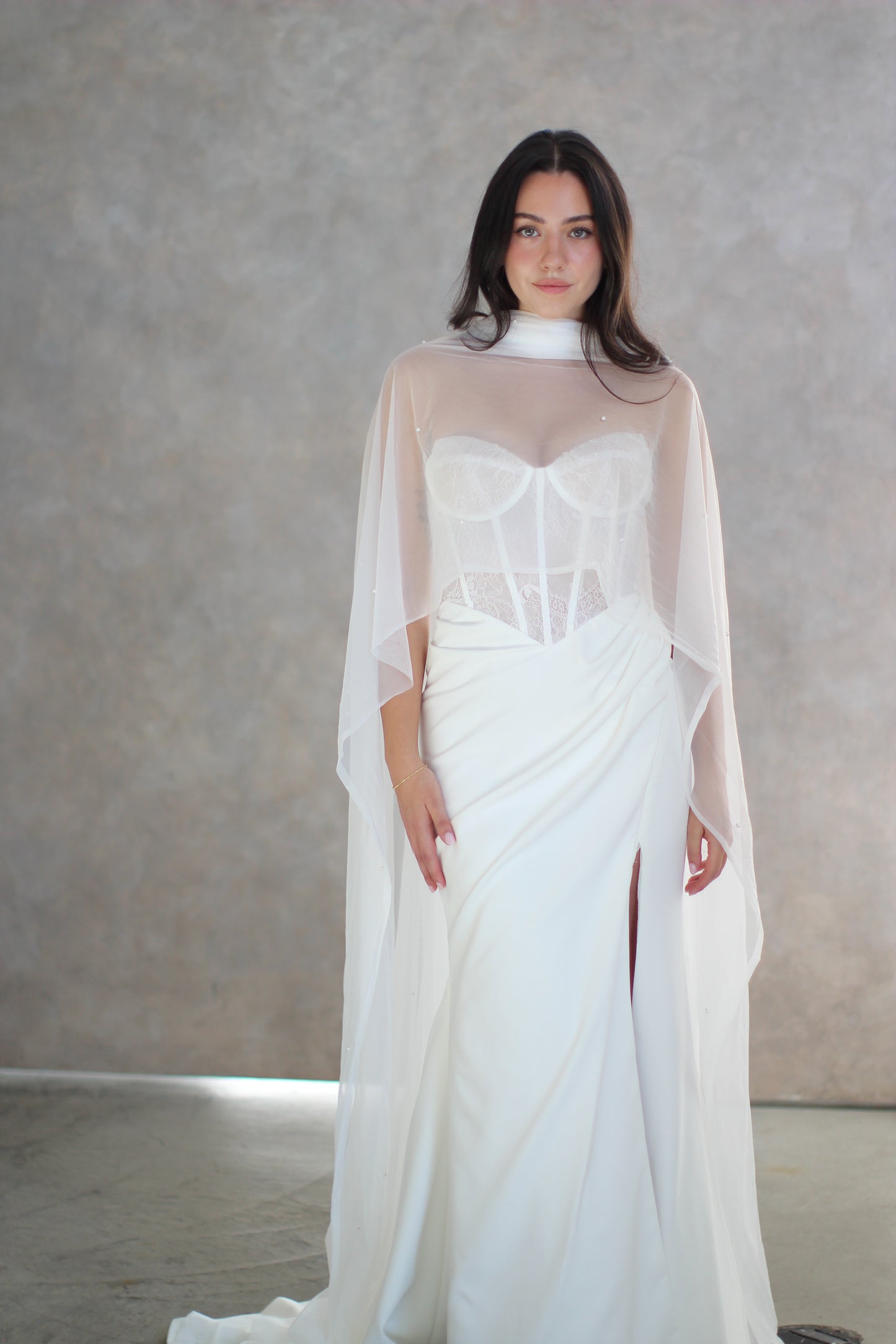 Sheer bridal shawl scarf worn over wedding dress